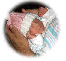 Riley in dads hands.JPG (12608 bytes)